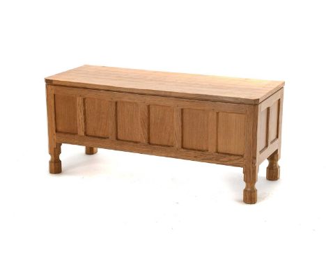 Workshop of Robert Mouseman Thompson (Kilburn): An English Oak Panelled Blanket Chest, the rectangular adzed hinged top, on f