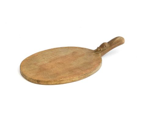 Workshop of Robert Mouseman Thompson (Kilburn): An English Oak Cheese Board, post 1960, of standard form, with carved mouse t