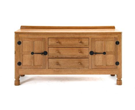 Workshop of Robert Mouseman Thompson (Kilburn): An English Oak 5ft Sideboard, with raised upstand, above two doors enclosing 