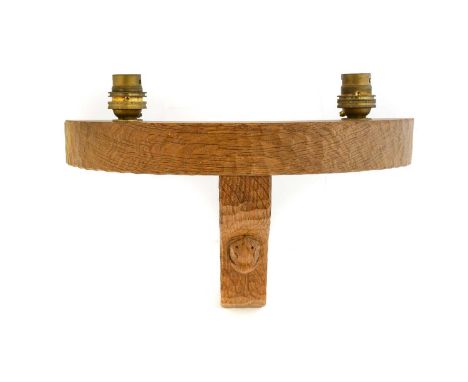 Workshop of Robert Mouseman Thompson (Kilburn): An English Oak Double Wall Light Bracket, semi-circular with two upward facin