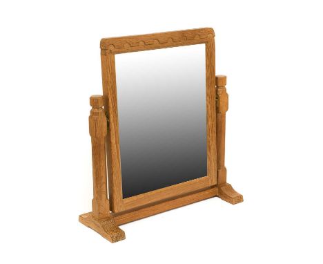 Workshop of Robert Mouseman Thompson (Kilburn): An English Oak Stand Mirror, the rectangular mirror pivots between two octago