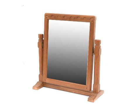 Workshop of Robert Mouseman Thompson (Kilburn): An English Oak Stand Mirror, the rectangular mirror pivots between two octago