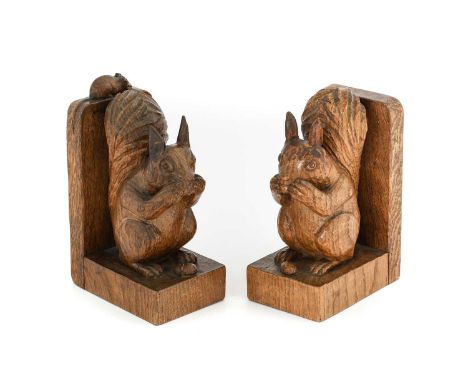 Robert Mouseman Thompson (1876-1955): A Pair of English Oak Squirrel Bookends, each carved with a squirrel sat on his haunche