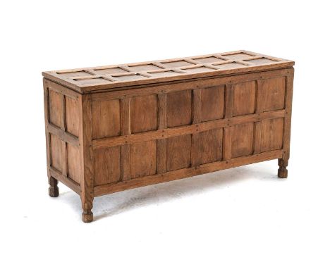 Sidney (Sid) Pollard (1914-1994) of Thirsk: An Oak Panelled Blanket Chest, the panelled rectangular top with brass hinges, on