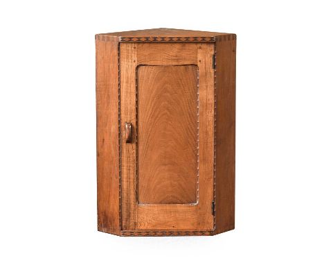 Stanley Webb Davies (1894-1978) of Windermere: A Chestnut Hanging Corner Cupboard, with thumbnail chip carving, the door encl