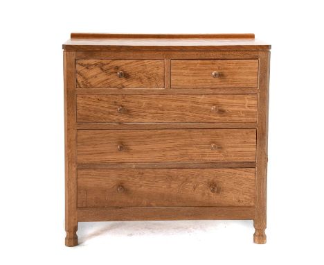 Workshop of Robert Mouseman Thompson (Kilburn): An English Oak Panelled Chest of Drawers, with raised upstand, above two shor