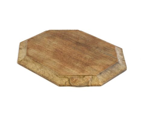 Workshop of Robert Mouseman Thompson (Kilburn): An English Oak Bread Board, of octagonal form, with carved mouse trademark, 3