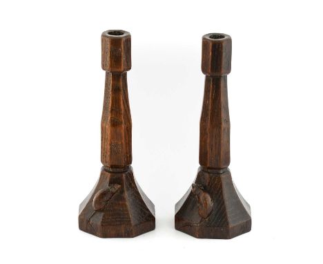 Robert Mouseman Thompson (1876-1955): A Pair of English Oak Candlesticks, circa 1930's, of octagonal form, each with carved m