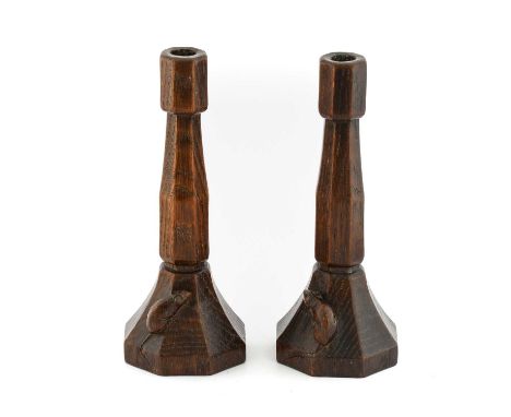 Robert Mouseman Thompson (1876-1955): A Pair of English Oak Candlesticks, circa 1930's, of octagonal form, each with carved m