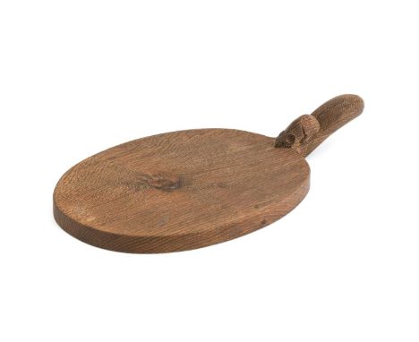 Workshop of Robert Mouseman Thompson (Kilburn): An English Oak Cheese Board, post 1960, of standard form, with carved mouse t