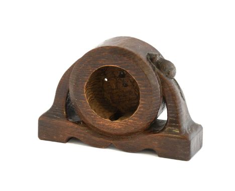 Robert Mouseman Thompson (1876-1955): An English Oak Mantel Clock, circa 1930s, the round center with pierced sides, on a sha