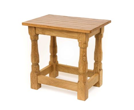 Workshop of Robert Mouseman Thompson (Kilburn): An English Oak Solid Top Stool, on four octagonal legs joined by stretchers, 