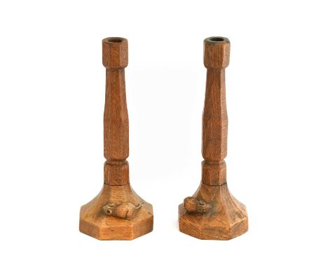 Robert Mouseman Thompson (1876-1955): A Pair of English Oak Candlesticks, of octagonal form, each with carved mouse trademark