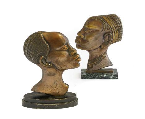 Two Art Deco Cast Bronze and Cast Metal Profile Portrait Busts, in the manner of Hagenauer, of an African man and woman, both