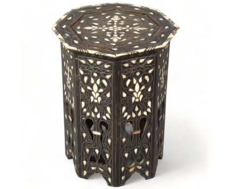 A Middle Eastern octagonal occasional table, with inlaid mother-of-pearl bone and wirework decoration, 37cm across 