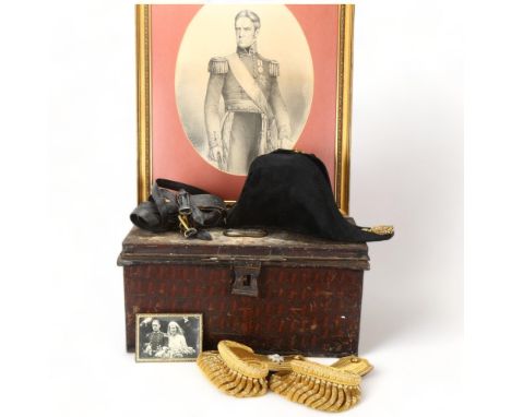 A Royal Navy bicorn hat and epaulettes, late 19th/early 20th century, by Gieve, Matthews & Seagrove Ltd, of Portsmouth London