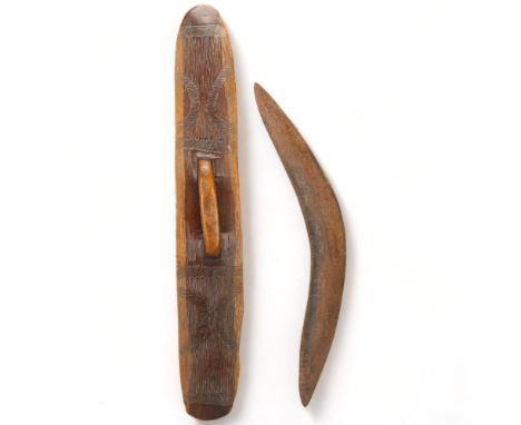 A 19th/20th century Australian Aboriginal hardwood shield, with Wunda style carved decoration, length 77cm, together with a c