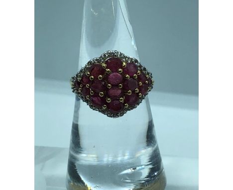 Ruby and Diamond Ladies Ring, Set with 15 Graduated Rubies, Flanked with small Diamonds, On a Silver Gilt Shank, Stamped 925,