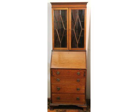Edwardian mahogany and inlaid boudoir bureau bookcase, the fall flap opening to reveal a fitted interior with two drawers ove