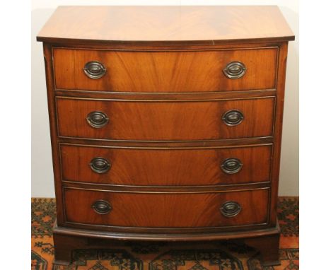 20th century mahogany and crossbanded bowfront chest of four long drawers with chamfered corners, raised on  bracket feet, 92