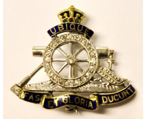 Royal Artillery brooch with diamonds and enamel in gold.