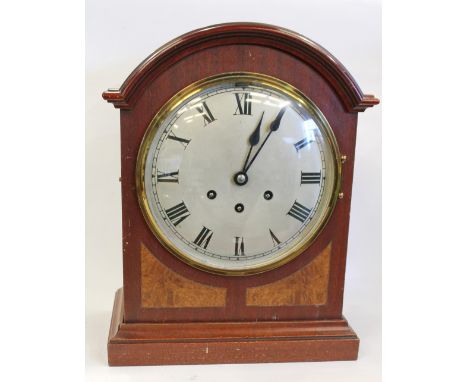 Edwardian arch top mantel clock in mahogany and walnut panelled case with chiming movement and steel dial with Roman numerals