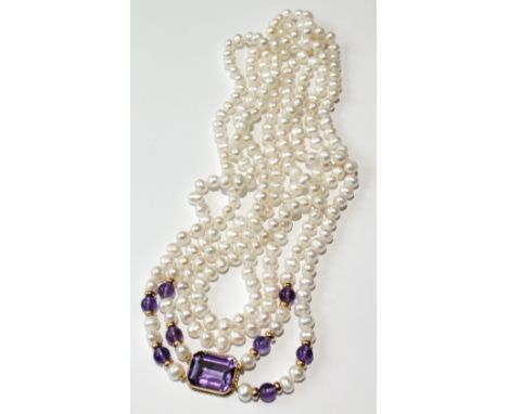 Cultured pearl necklet of two rows, opera length, with amethyst and gold snap and beads. Condition Report Good condition.
