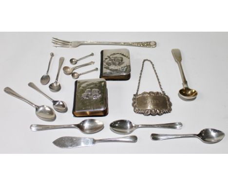 Two mounted prayer books, a decanter label and various silver items.