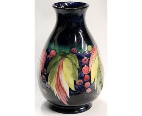 Large Moorcroft vase of 'Leaf and Berry' design, 38cm high. Condition Report Generally in good condition.  Light glaze cracks