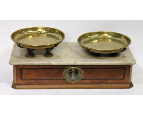 Victorian counter scales with a pair of brass pans, in stained wood case with central glass dial and marble panel top, 40cm l