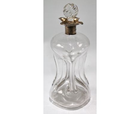 Victorian glass spirits decanter with pinched sides and quadruple spout, by Huttons, 1894.