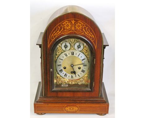 Edwardian arch top mantel clock in mahogany and inlaid case, the arch top glazed door enclosing a brass and steel dial with s