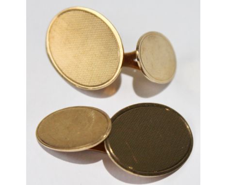 Pair of 9ct gold cufflinks, engine-turned, and plain ovals. Condition Report 7.6g
