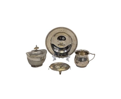 Assorted silver items, comprising a Mappin & Webb armada dish, a small footed pin dish, an Edwardian reeded tea caddy and a c
