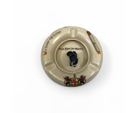 A Carlton Felix the Cat crested ware ashtray, inscribed with the motto "Who Burnt the Cloth" to the rim and "Felix Kept on Wa