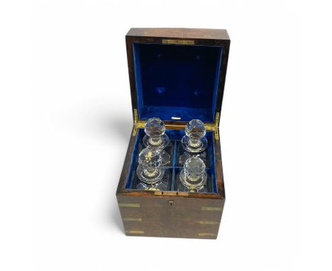 An Army & Navy brass bound walnut decanter box, the top centered with a brass plaque inscribed C.H.V FROM C.F.V 24.7.01, open