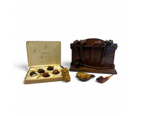 A collection of pipes, comprising a cased Viking gold tone briar pipe with five interchangeable bowls, a meerschaum example i
