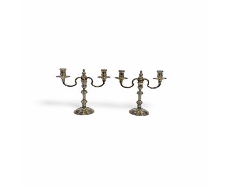 A pair of silver twin branch candelabra, by WIlliam Comyns & Sons Ltd, London, 1966, the turned sconces and circular drip pan