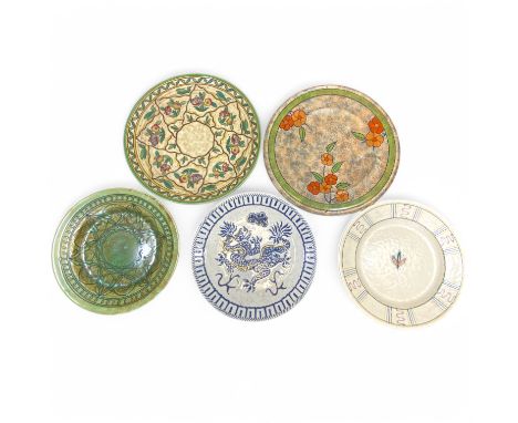 Charlotte Rhead for Crown Ducal, five assorted wall plaques or chargers, comprising a Crown Ducal 6016 Trellis pattern exampl