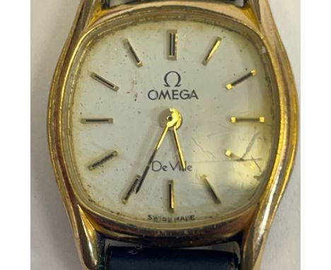 A ladies Omega De Ville quartz wristwatch with box and papers. White dial with baton markers in a stainless steel and gold co