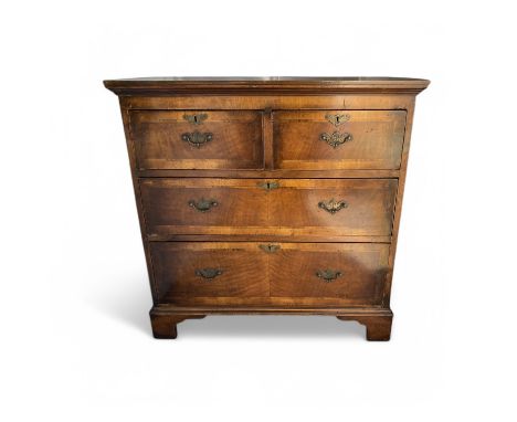 A 19th century mahogany and crossbanded chest of two short and two long drawers, with bracket feet