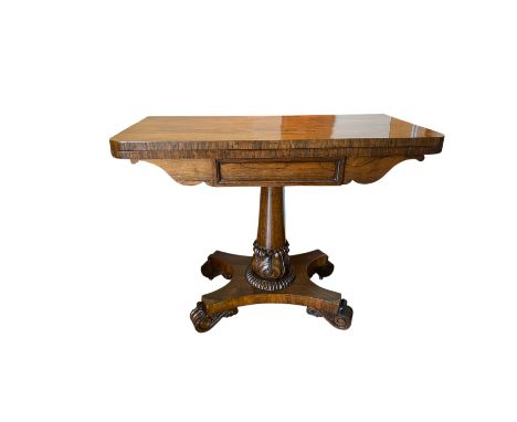 A William IV rosewood card table, the rectangular top over a turned column with acanthus leaf decoration, on a quadripartite 