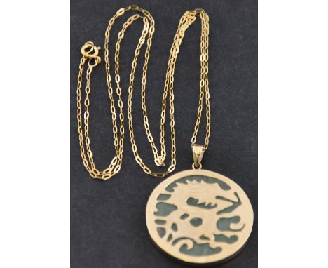 A cased 9ct gold and jade pendant of a dragon and chain