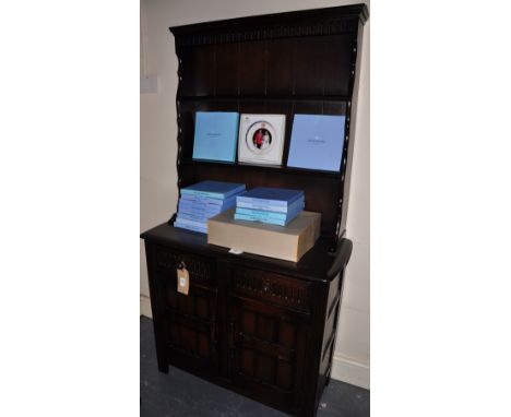 A narrow Ercol style oak dresser fitted two drawers
