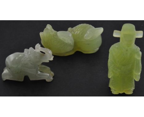 A carved jade figure of a wise elder, H. 9cm, together with a similar group, two birds nesting, and another figure carved as 