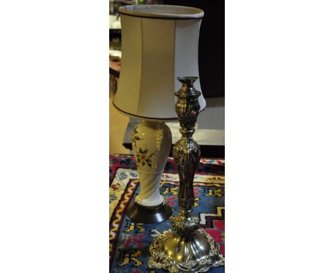 A Victorian silver plated lamp base of Rococo baluster form together with a pottery lamp base and shade 