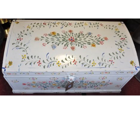 A Swiss style cream painted, domed top trunk painted with floral sprays, W: 80cm
