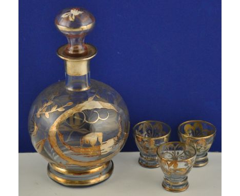 An early 20th Century sherry decanter with overlaid white metal decoration, H. 20cm, together with three matching glasses (4)