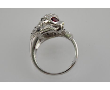 A silver and cubic ziconia panther ring with ruby eyes