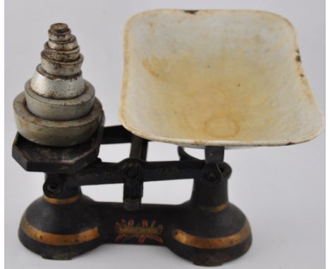 A late Victorian W. B. & Co. cast iron dogs head doorstop, together with a set of vintage kitchen scales and weights